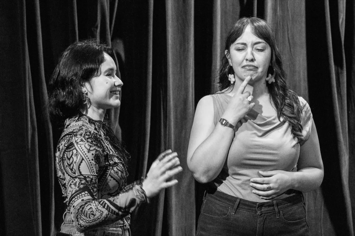 Two students in a scene during a Bilingual Improv School class